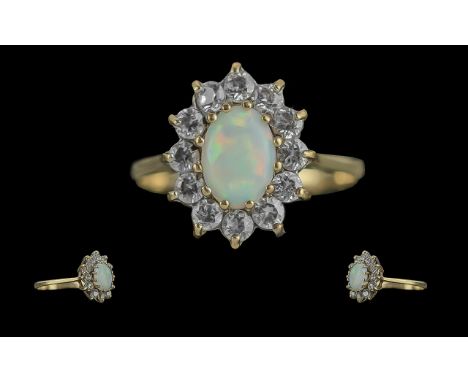 Ladies 9ct Gold Attractive Opal and Diamond Set Ring. Flower head Design. Full Hallmark to Interior of Shank. The Central Opa