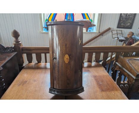 A Mahogany Regency Style Miniature Bow Fronted Corner Cupboard with shell inlay to front hinged door. Height 24'', 12'' x 9''