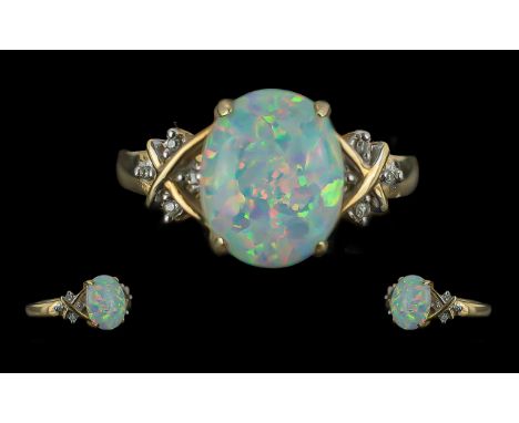 Ladies 10ct Gold Opal and Diamond Set Ring, marked 10ct to shank, the centre opal with diamond set shoulders; ring size N, we