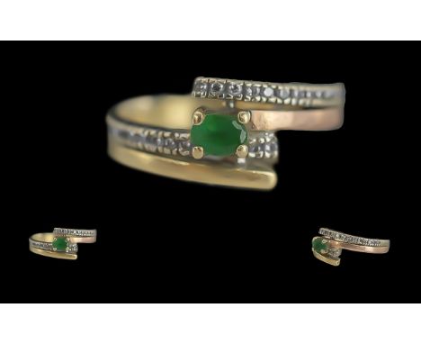 Ladies 14ct Gold Emerald and Diamond Set Ring. Marked 14ct to Interior of Shank. Set with 26 Well Matched Diamonds. Ring Size