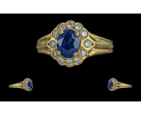Ladies Excellent 18ct Gold Sapphire and Diamond Set Cluster Ring. Flower head Setting. Marked 18ct to Shank. The Central Blue