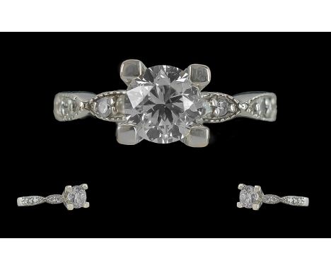 Ladies 18ct White Gold Excellent Quality Single Stone Diamond Set Ring, with Diamond Shoulders. The Single Brilliant Cut Roun