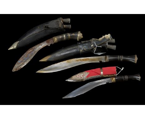 Presentation Kukri in silver decorated scabbard and current British Army issue service Kukri in black leather scabbard.  Both