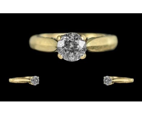18ct Gold Excellent Diamond Set Ring. Full Hallmark to Interior of Shank. The Central Brilliant Cut Diamond of Top Colour and