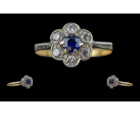 Ladies Pleasing and Petite 18ct Gold Diamond Set Cluster Ring, flower head setting, marked 750 to shank, the seven well match