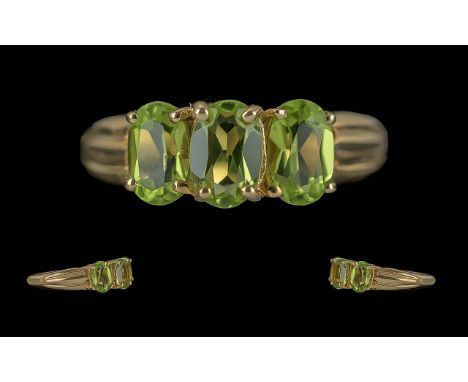 Ladies 9ct Gold Attractive 3 Stone Peridot Set Ring. Full Hallmark to Shank. Peridots of Good Colour / Clarity. Est 1.50 cts,