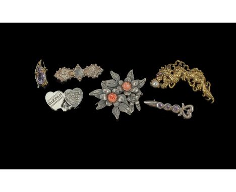 Six Silver Brooches, comprising a bow shaped brooch, a dragon brooch set with red stone eyes and clasping a pearl, a bee set 