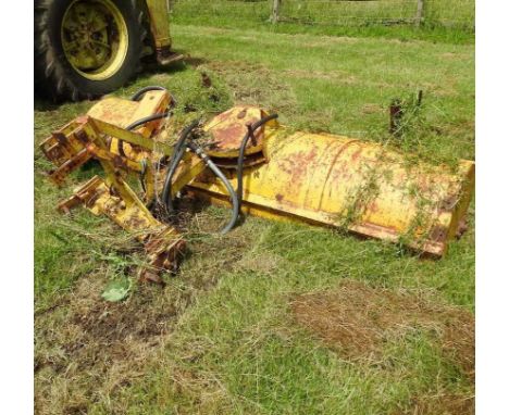 A tractor mounted yard brush