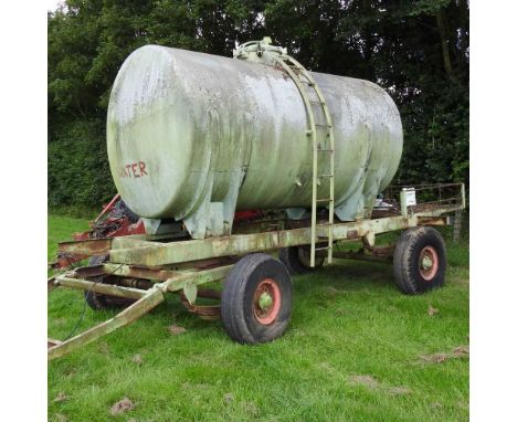 Plus VAT - A farm trailer, with a water bowser/tank, approximately 7m long
