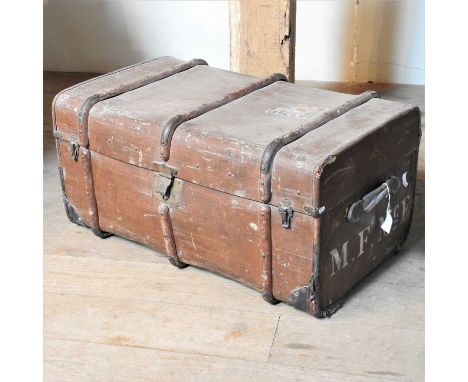 A 19th century wooden bound travel trunk, inscribed M F McE (for M F McEwen, an in-law of Lord Hesketh) and bearing a travel 