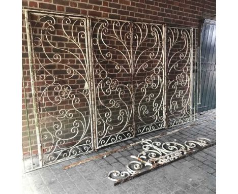 A large mid 20th century cream painted metal entrance way, in four sections with two central gates and two side panels includ