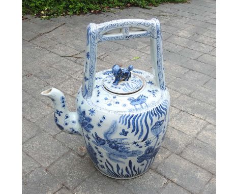 A large blue and white Chinese teapot and cover, 20th century, 63cm high