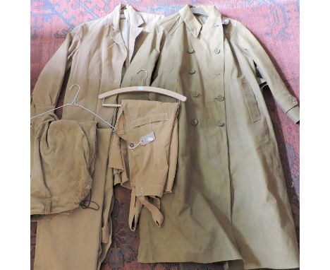 A World War II women's Land Army uniform, comprising a heavy duty belted coat, jacket dated 1943, another jacket dated 1944 f