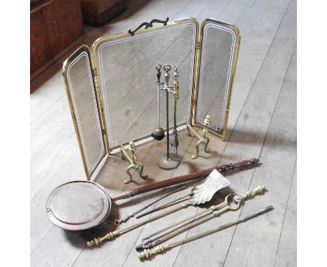 A glazed brass fire screen, together with various fire tools and a brass warming pan