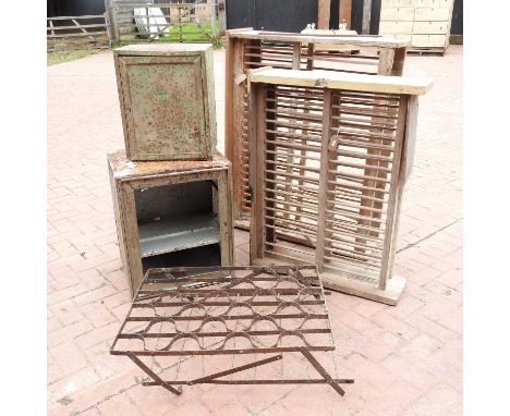 An antique pine plate rack, 15cm wide, together with another, a larder cabinet, an oak spice cupboard, and an iron bottle rac