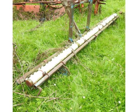 A tractor mounted weed wiper