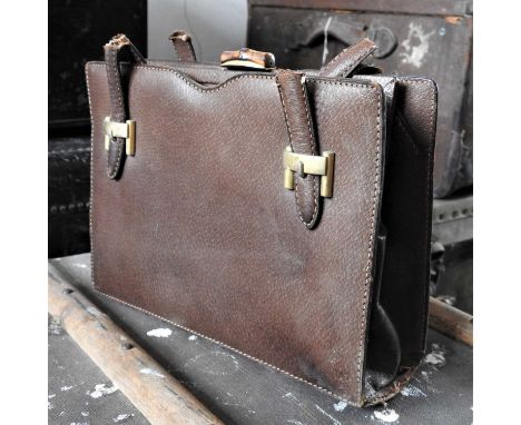 A vintage Gucci brown leather handbag, missing handles