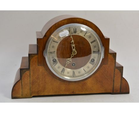 A walnut cased Art Deco mantle clock.