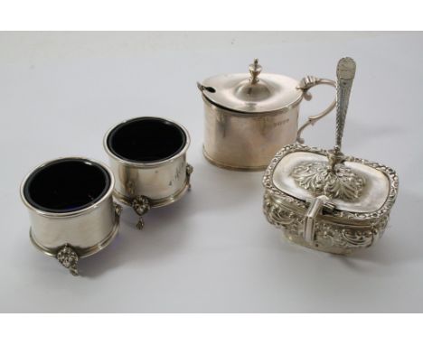 A three piece silver condiment set together with a silver table salt and spoon.