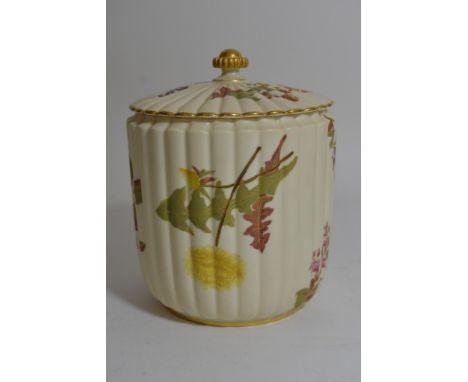 A Royal Worcester jar and cover decorated with flowers and foliage