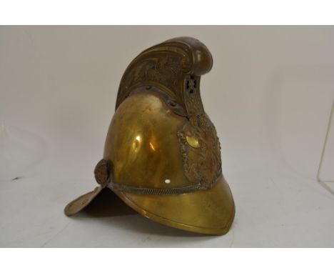 A Victorian brass fireman's helmet.
