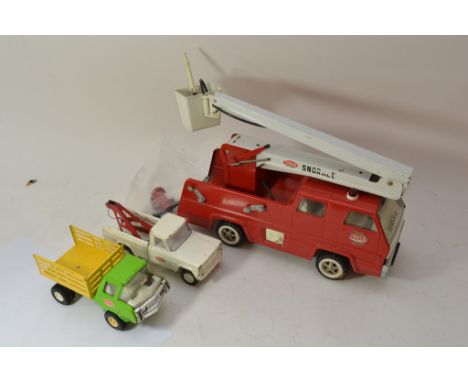 A Tonka fire engine and two trucks