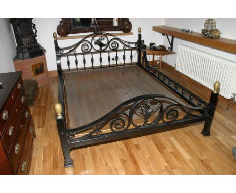A bespoke wrought iron bed frame with scroll decoration and vertical supports 183x142 cm frame size