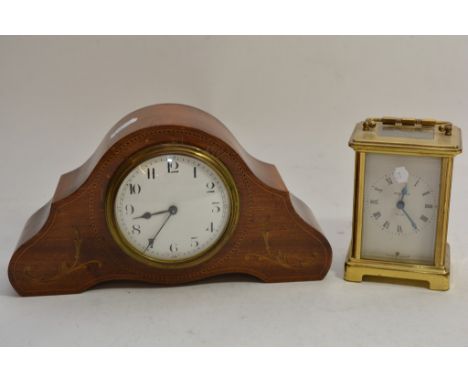 An Edwardian inlaid mantle clock and a French brass cased 8 day carriage clock.