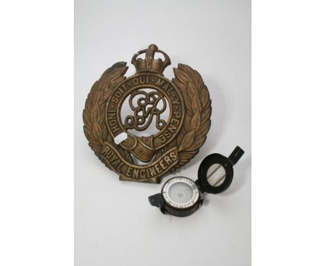 A small military compass dated 1944 and a Royal Engineers metal plaque 
