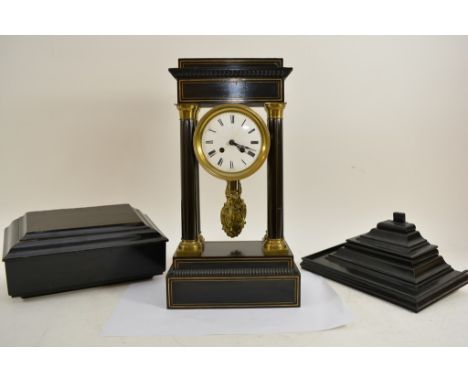 An ebonized Victorian four pillar mantle clock, the enamel dial with Roman Numerals and Classical pendulum