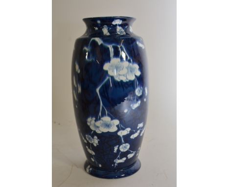 A Carltonware blue and white vase decorated with prunus blossom.
