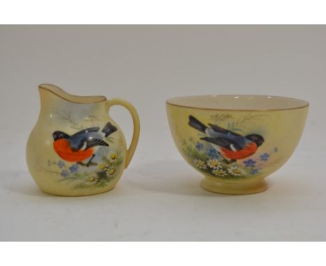 A Locke & Co Worcester sugar bowl and matching milk jug both having hand painted decoration of birds.