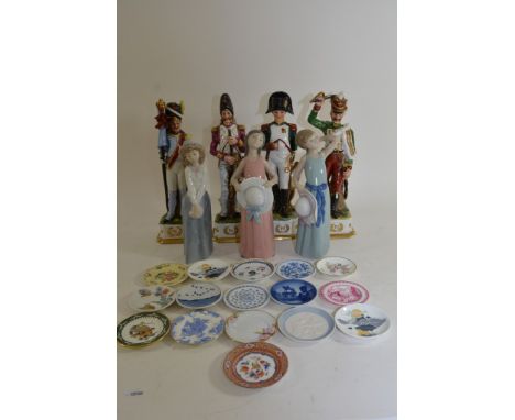 Two Lladro figures together with one Nao, four figures of Napoleonic soldiers and a collection of small ceramic dishes.