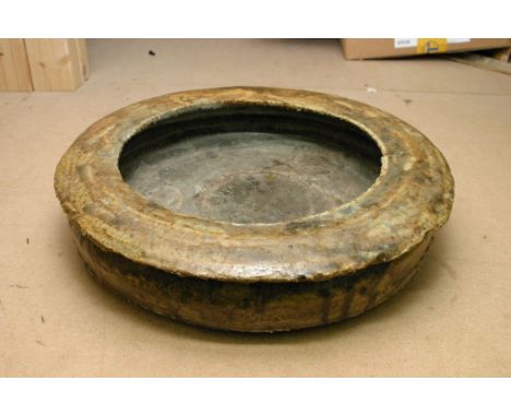 An unusual contemporary ceramic stoneware dish of circular shape 