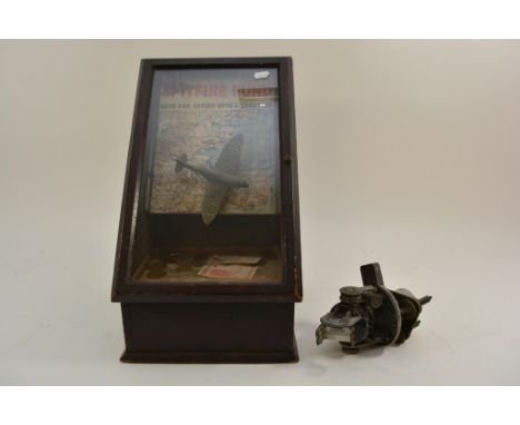A Spitfire fund box and an old Astro Compass Mark II airline sight.