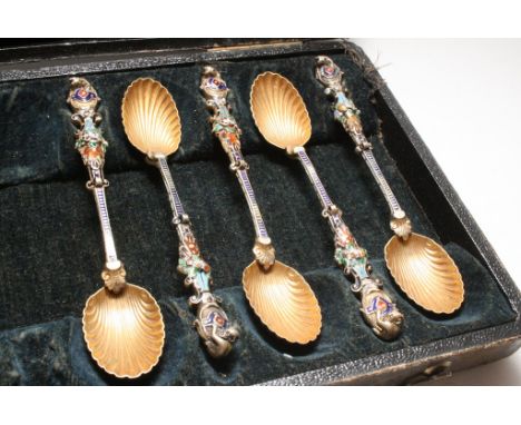 Ten white metal and enamel spoons, possibly Russian.