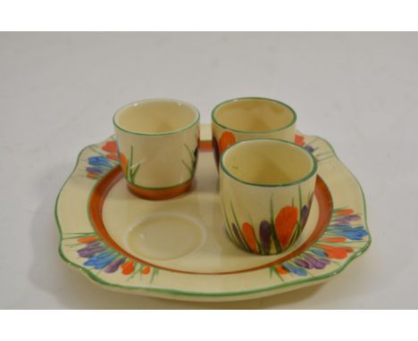 A Clarice Cliff egg set in Crocus pattern (missing one egg cup).