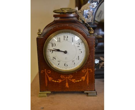 An Edwardian inlaid carriage clock.