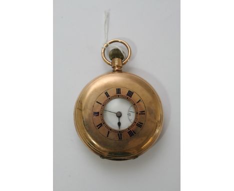 A 9ct gold half hunter button wind pocket watch.