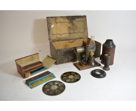 An antique magic lantern and slides in original box.