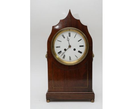 A Victorian mahogany Gothic style mantle clock, the enamel dial with Roman numerals, French Movement, striking on bell 