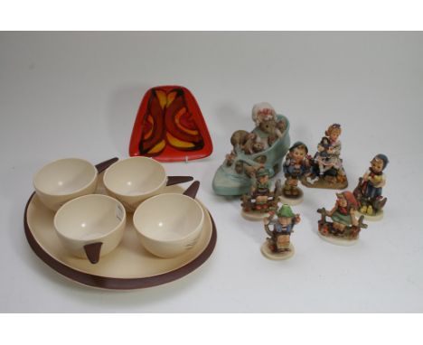 A collection of ceramics including a Poole Delphis dish, Carltonware tableware, five Hummel figures and two boxed ceramic orn