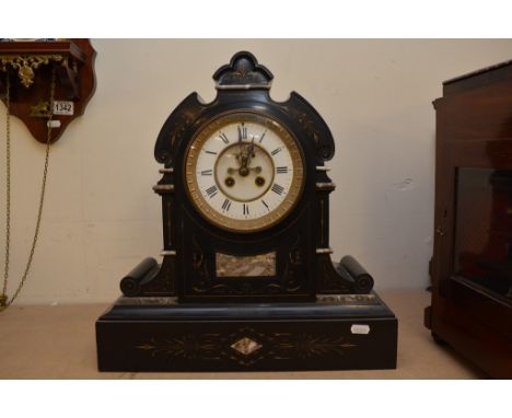 A large black marble mantle clock with enamel dial and  key