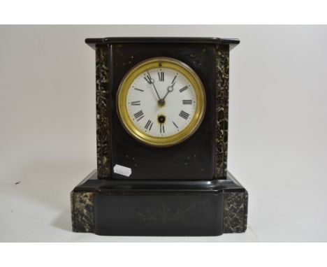 A black slate mantle clock with marbled corners and white enamel dial.