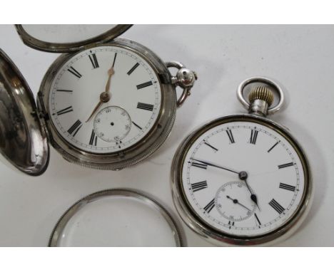 A silver cased full hunter pocket watch and a top winding pocket watch