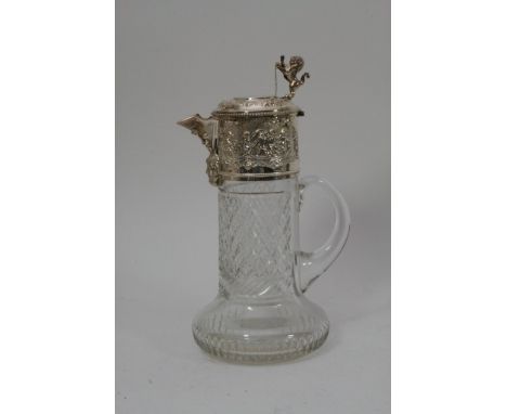 A fine quality glass decanter with silver plated lid and collar depicting cherubs.