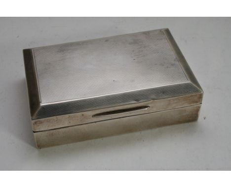 A silver cigarette box with engine turned decoration, Birmingham 1938.