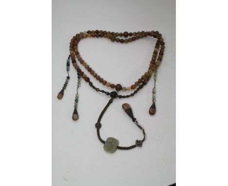 A set of Chinese hardstone court robe beads including some carved and possible silver mounted beads. Approximate length: 100c