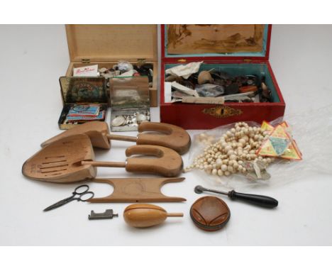 A collection of vintage buttons, ivory beads and sewing tools
