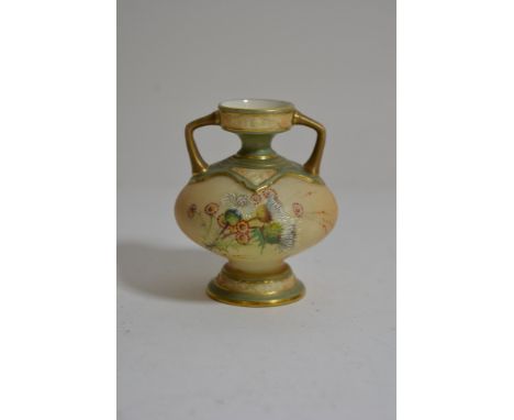 A small handpainted Royal Worcester twin handled bud vase with floral decoration on a blush ivory ground. 